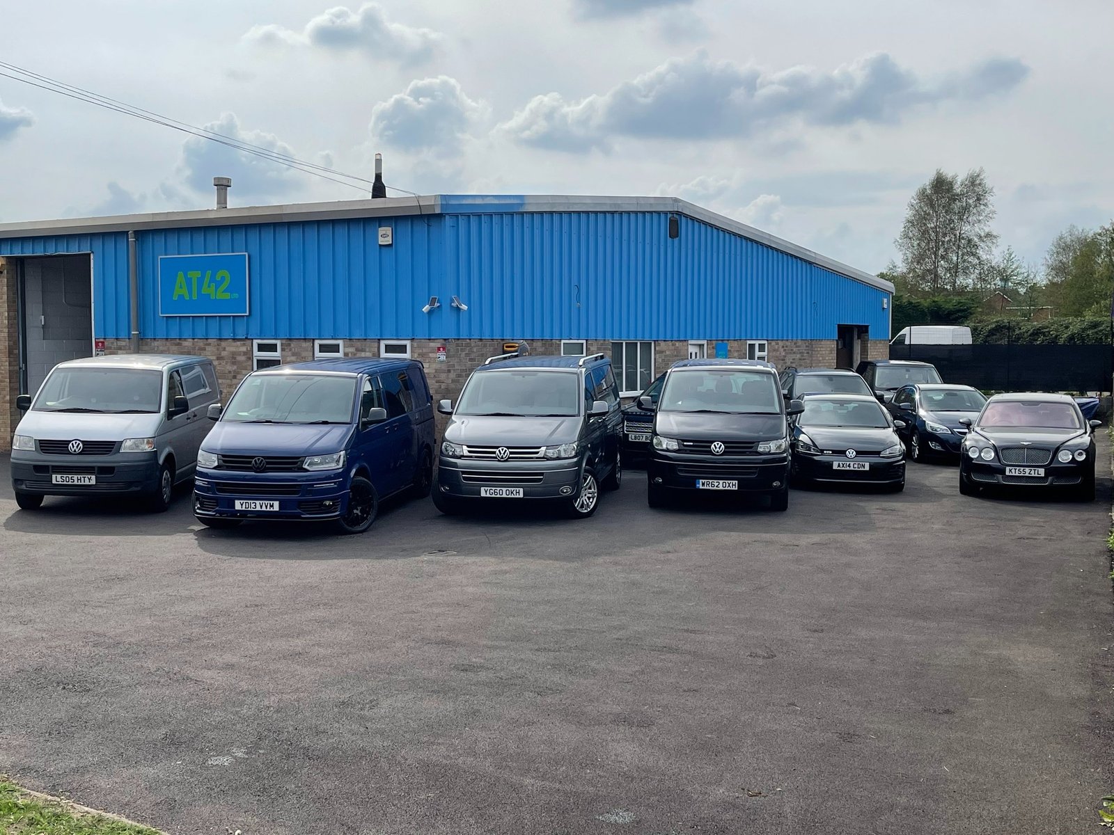 The AT42 garage with cars and vans out front